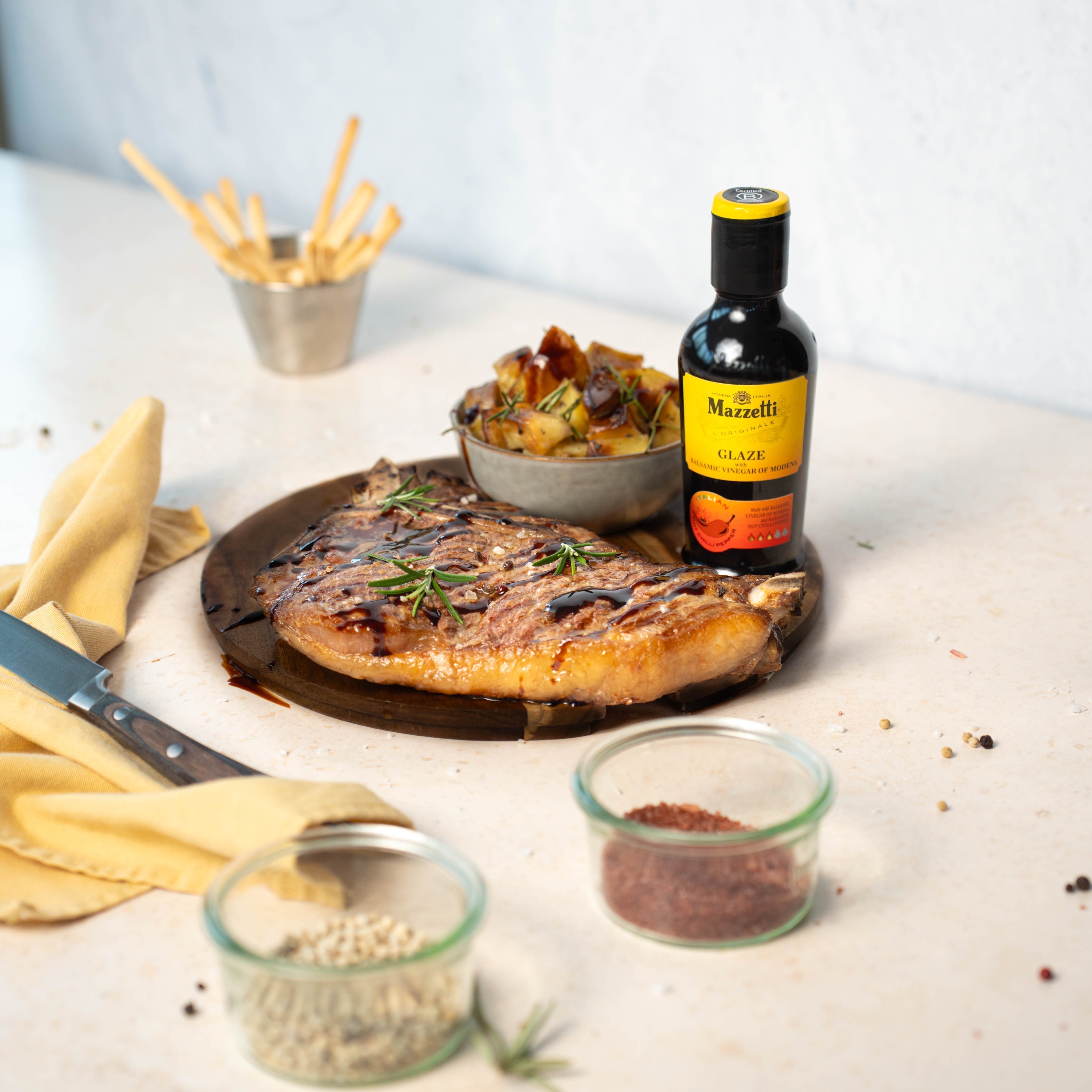 Mixed Grilled Meat BBQ with Potatoes and Hot Chilli Pepper Balsamic glaze