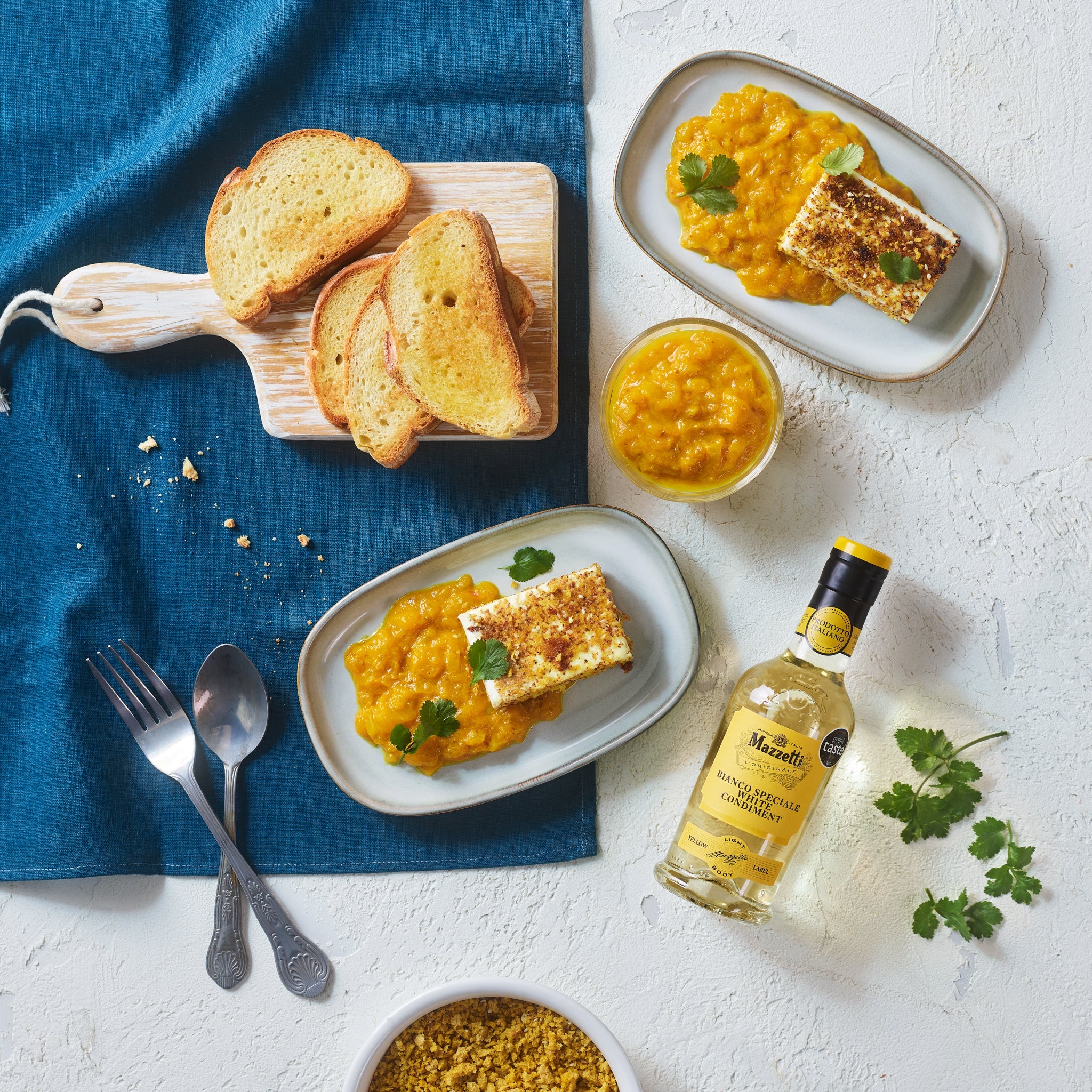 Seared feta with bread crumbs and mango sauce with White Condiment