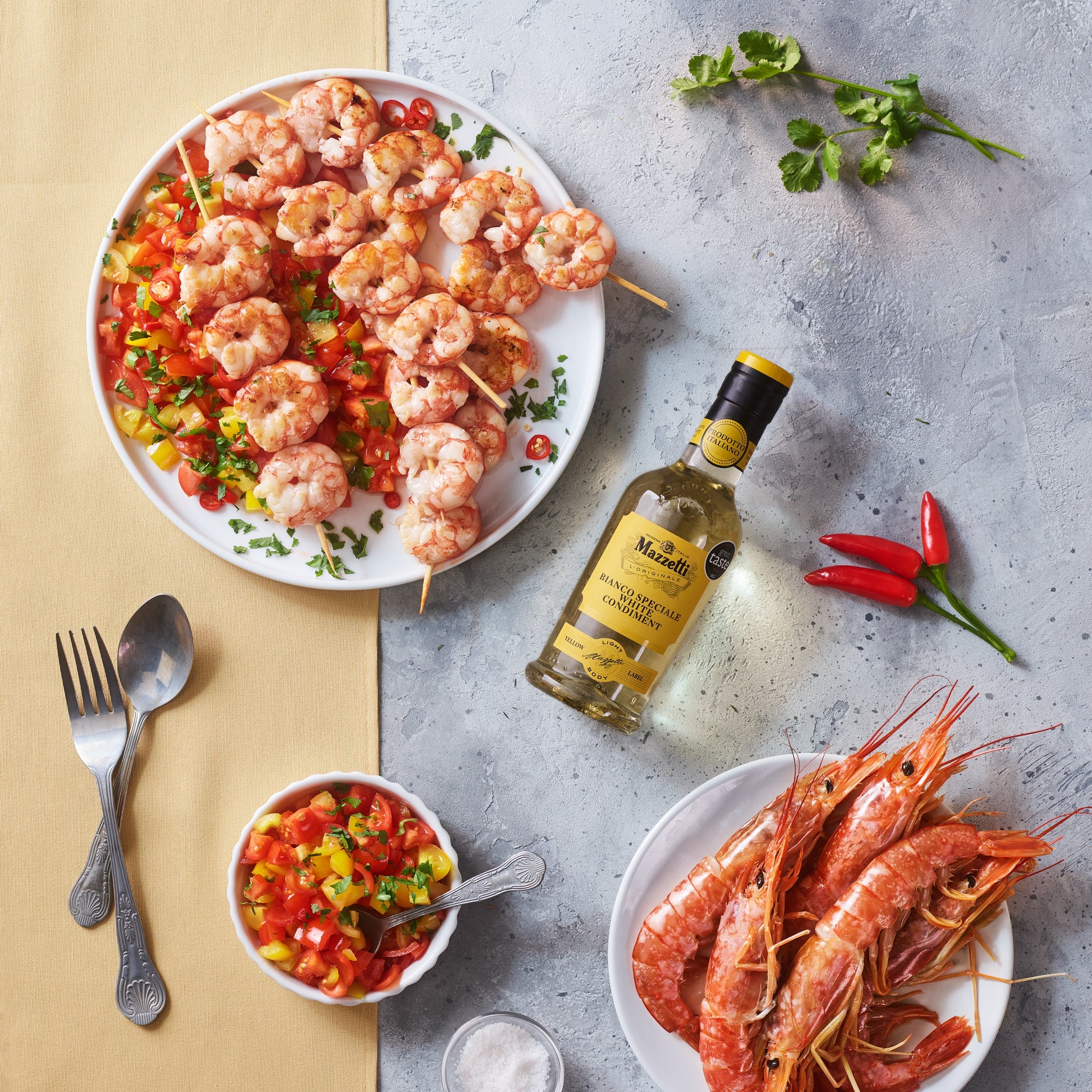 Prawn skewers with tomatoes, fresh chilli, coriander and White Condiment