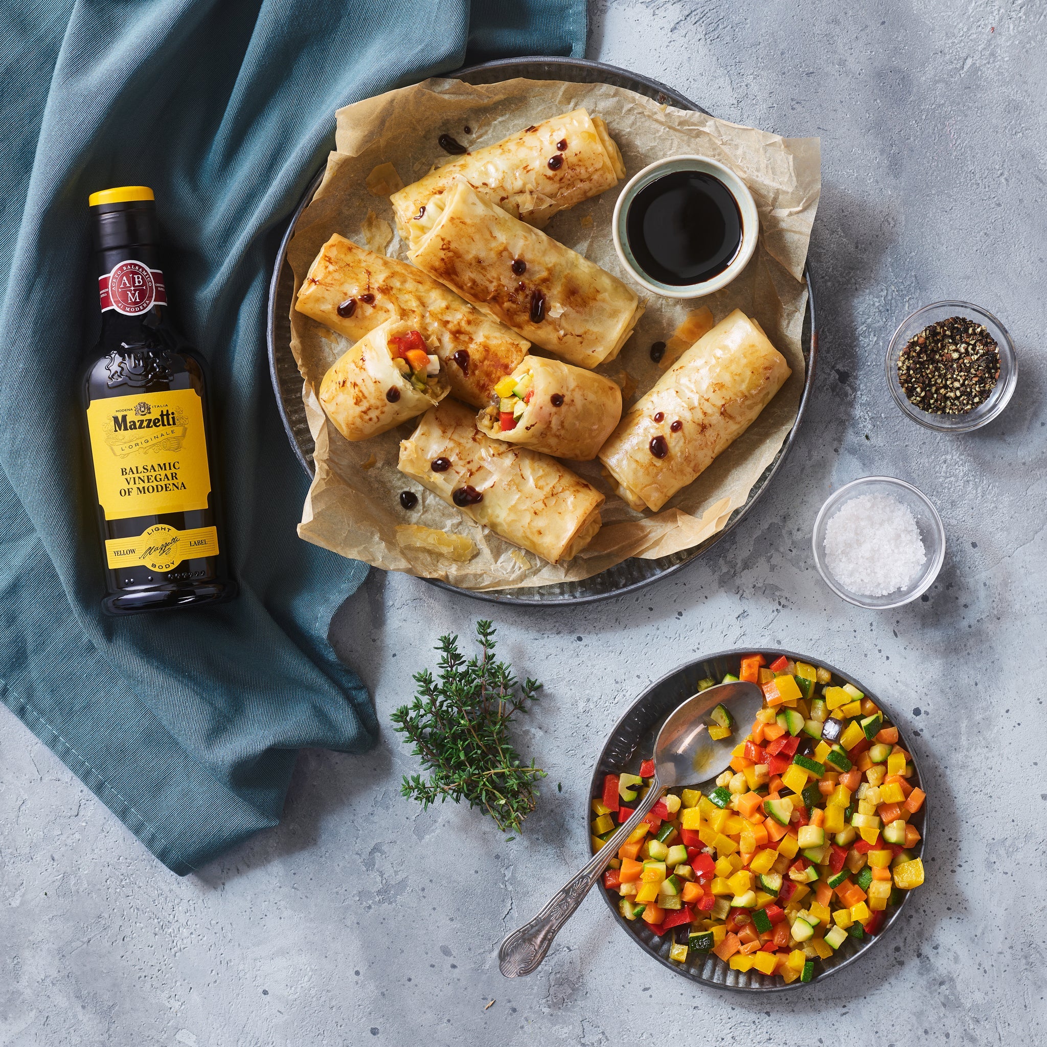 Phyllo dough rolls with diced vegetables, cheese, and Balsamic Vinegar